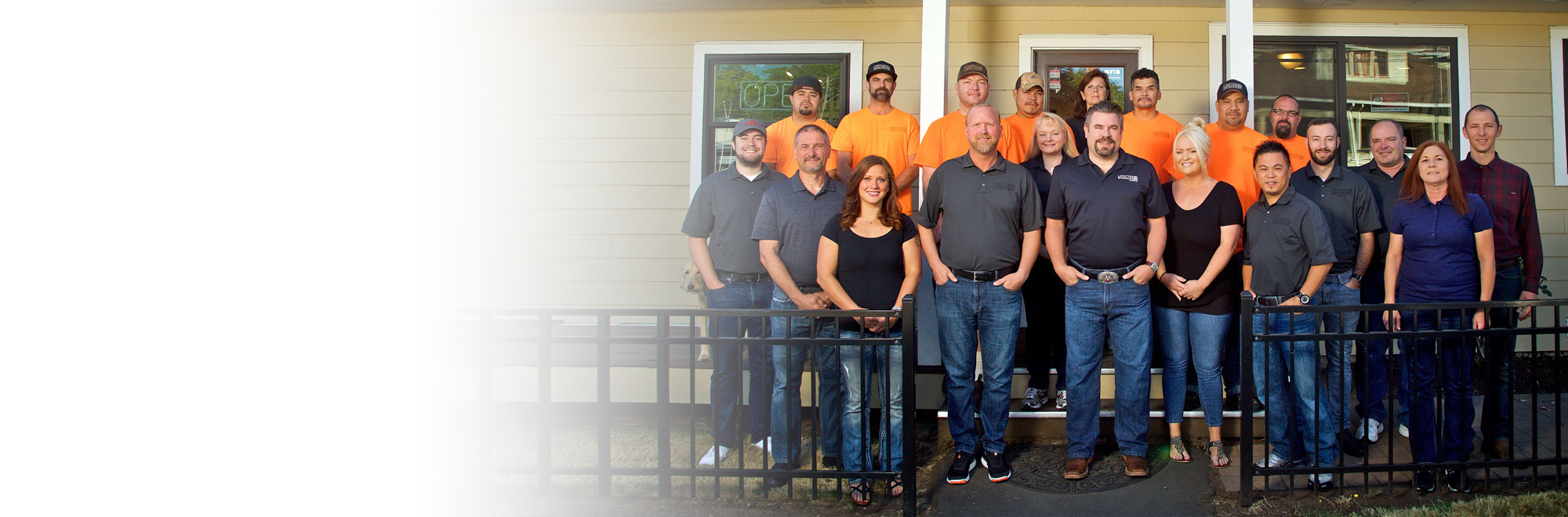 A Lifetime install crew working together at a jobsite, branded truck visible