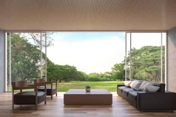 A moving glass wall system opening a room to the outdoors